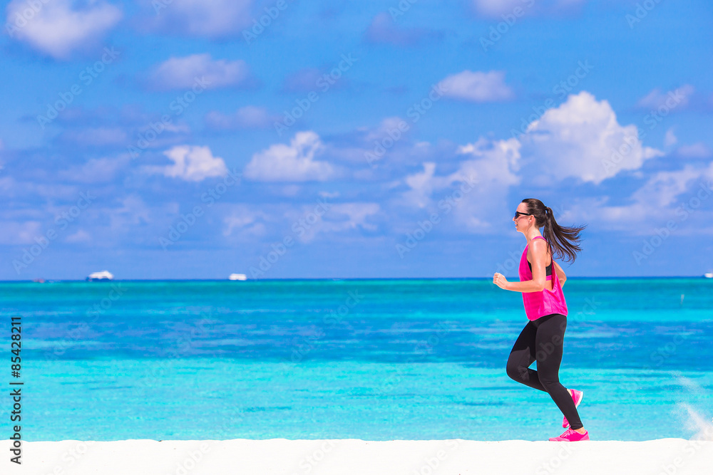 Healthy athlete woman working out doing exercise on tropical Healthy athlete woman working out doing exercise on tropical