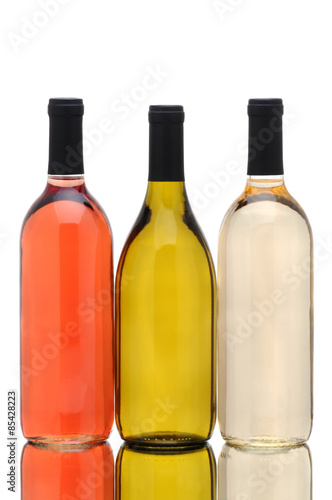 Three Wine Bottles over a White Background
