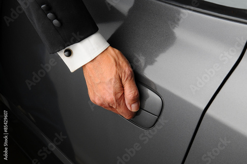 Man in Tuxedo Opening Car Door