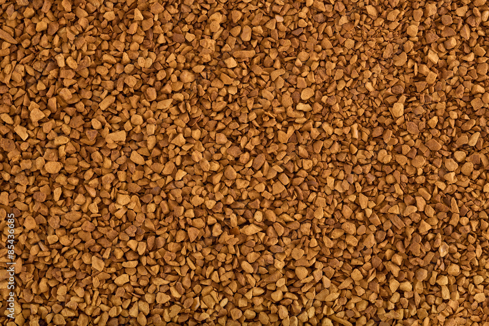 Instant coffee granules, close up shot, for background. A food background theme.