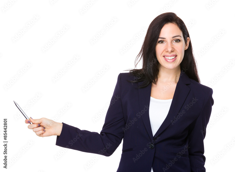 Confident businesswoman with pen pointing something Confident businesswoman with pen pointing something