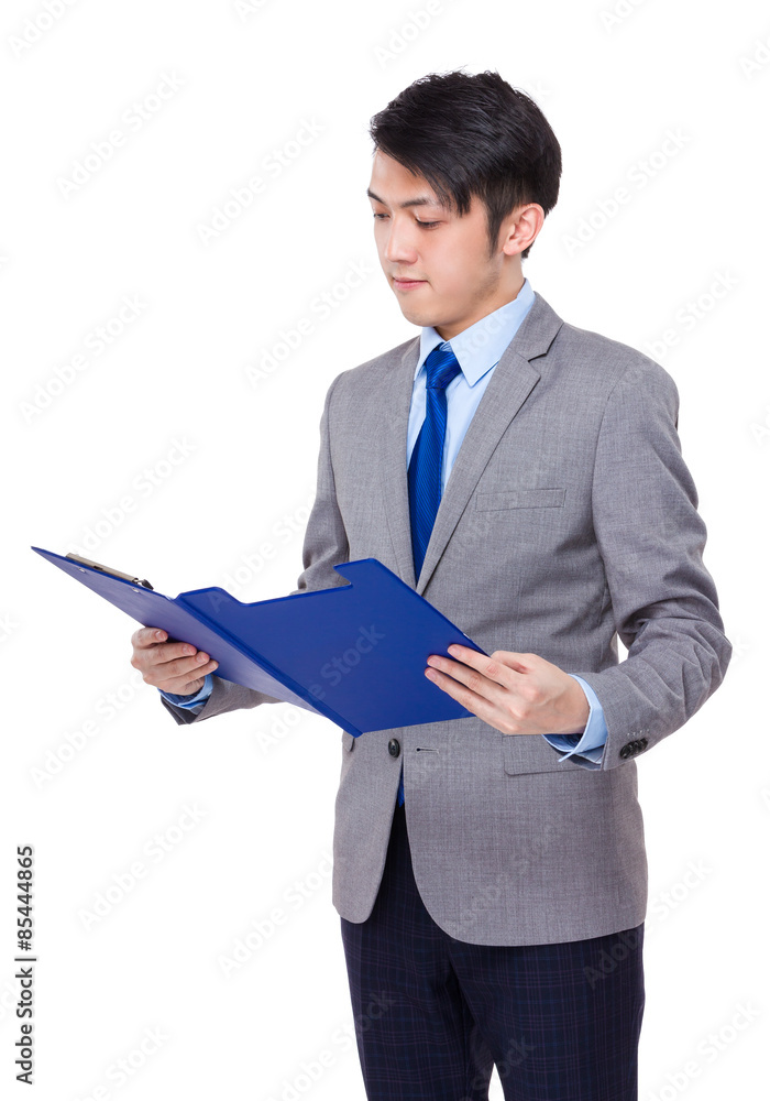 Confident businessman read on the report