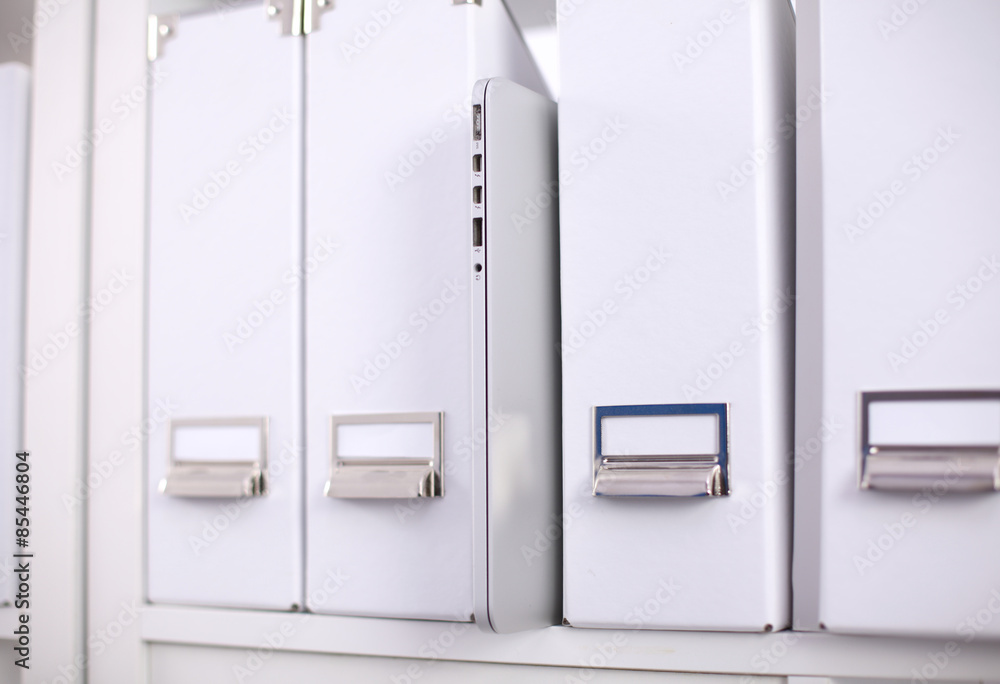 Folders for documents on a book shelf at office Folders for documents on a book shelf at office