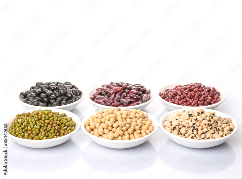 Fototapeta premium Beans variety in white bowl over white background