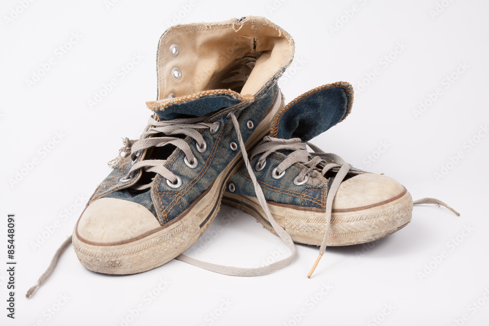 Old & Torn shoes isolated on white background Old & Torn shoes isolated on white background