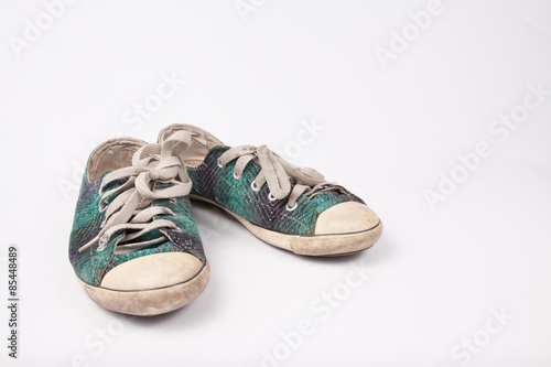 Old & Torn shoes isolated on white background