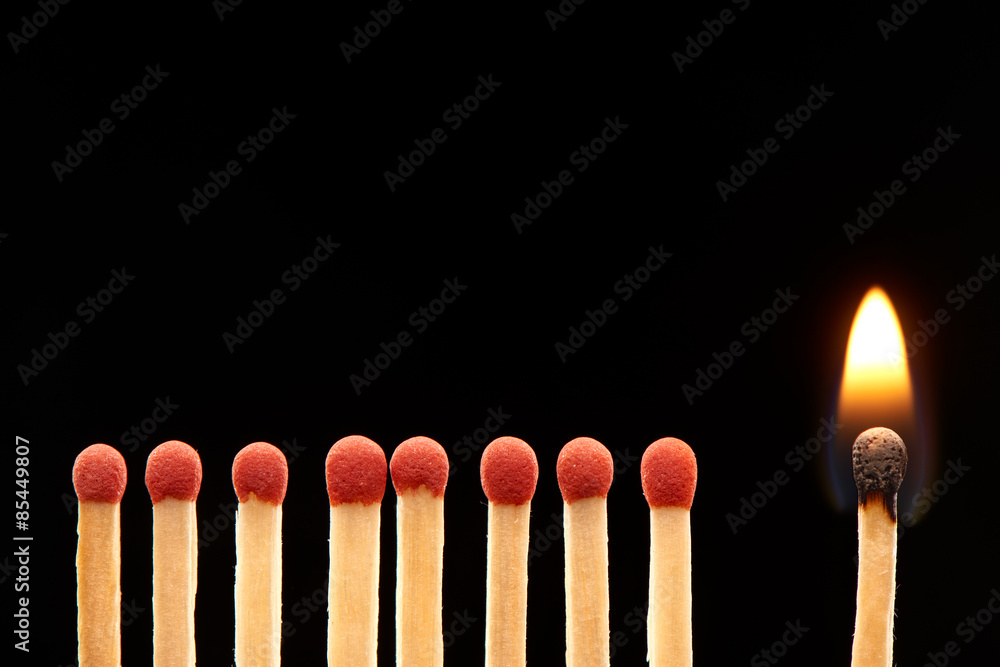 Set of eight red and one burning wooden matches Set of eight red and one burning wooden matches