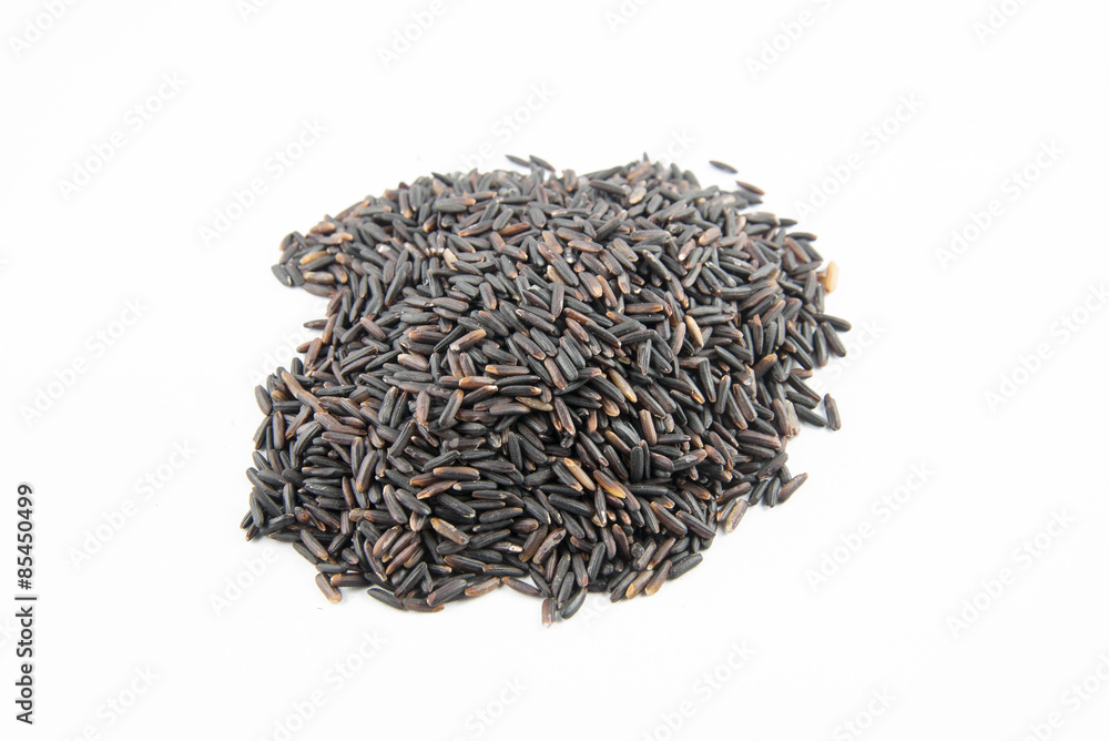 Closeup of raw purple Riceberry rice, it is a crossbred between Thai Hom Nil (black jasmine rice) and white Jasmine rice Closeup of raw purple Riceberry rice, it is a crossbred between Thai Hom Nil (black jasmine rice) and white Jasmine rice