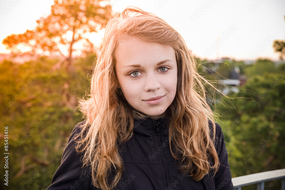 Caucasian blond girl with bright evening sunlight Caucasian blond girl with bright evening sunlight