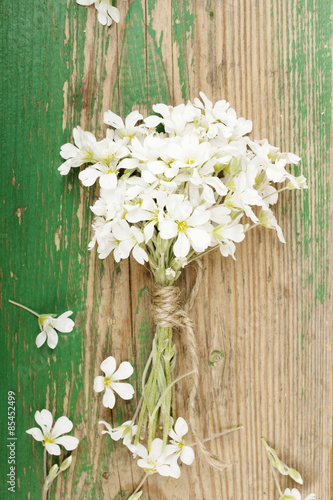 flower bouquet on wooden planks