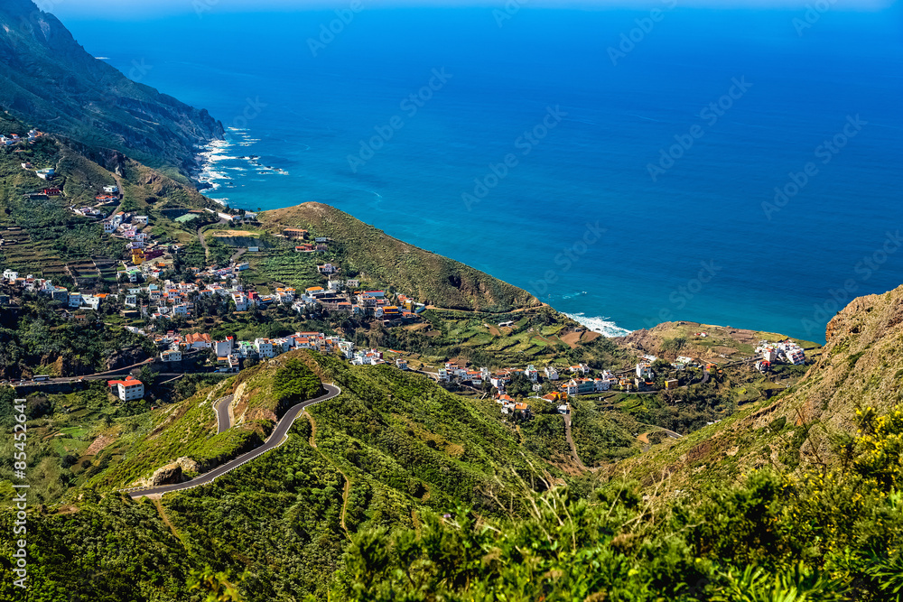 Mountain and clouds with small city or village Mountain and clouds with small city or village
