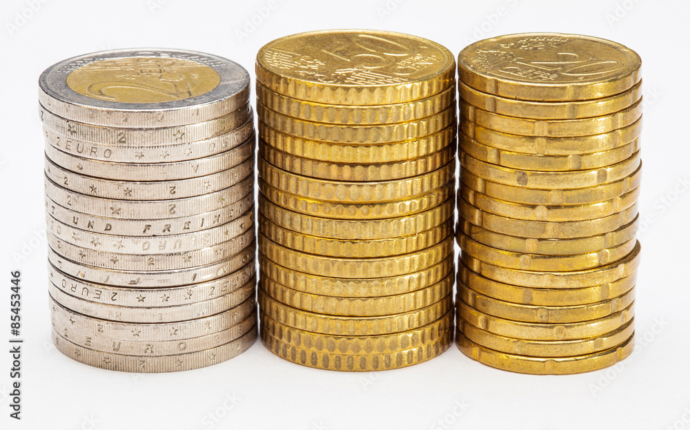 Stacked coins - side view of columns of euro coins Stacked coins - side view of columns of euro coins