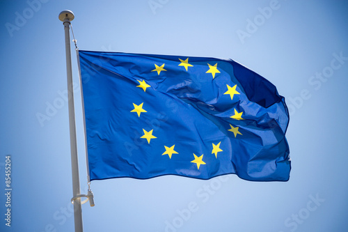 European Union flag on blue sky background