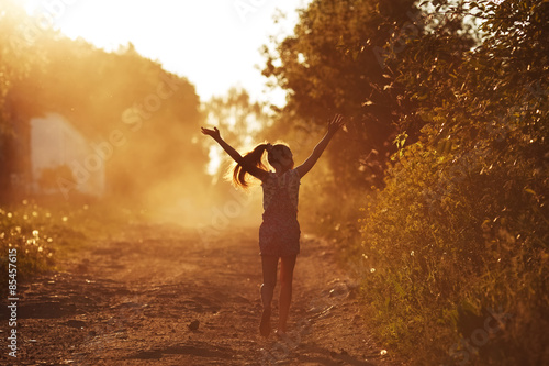Happy girl running on a dusty road © dimedrol68