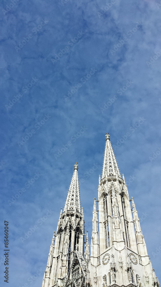 Votive Church Spires in Vienna, Austria against a Blue Sky.