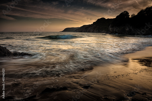 Dusk at Caswell Bay  Caswell Bay  one of the most popular and easily accessible beaches on the Gower peninsular in Swansea