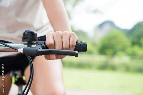 woman riding a bicycle in park