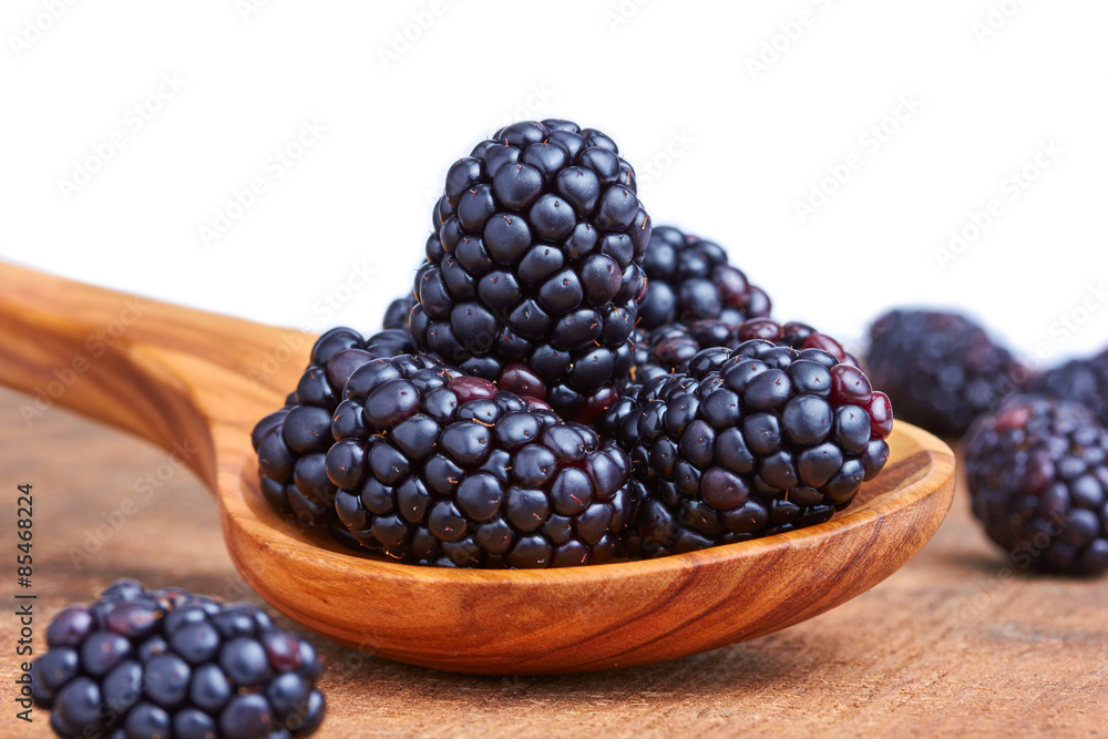Bowl of yogurt and fresh Blackberries on a wooden table Bowl of yogurt and fresh Blackberries on a wooden table