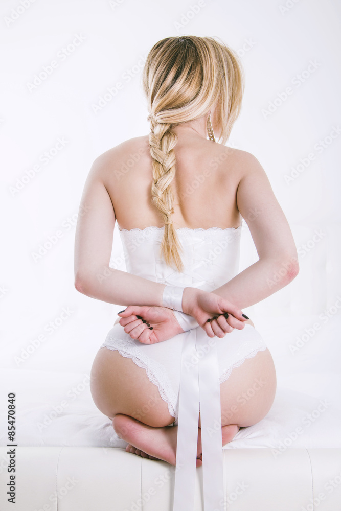 Sexy woman in white panties with hands tied from back foto de Stock | Adobe  Stock