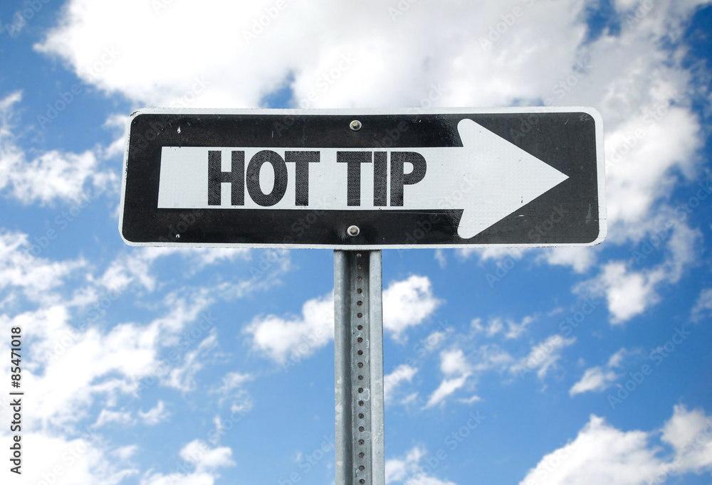 Hot Tip direction sign with sky background