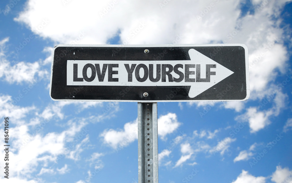 Love Yourself direction sign with sky background Love Yourself direction sign with sky background