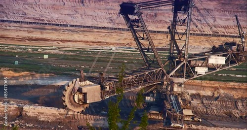 Giant Brown Coal Mine with Bucket Wheel Excavator. Shoot on Digital Cinema Camera in 4k - ProRes 422 codec photo