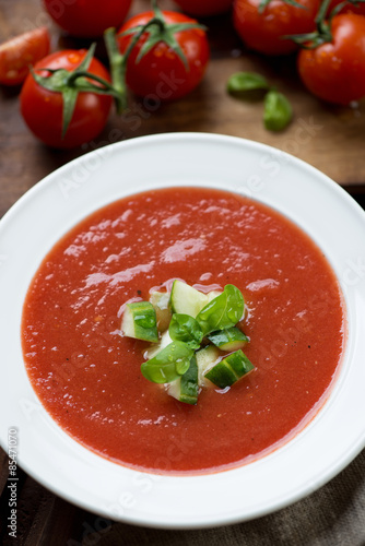 Close-up of gazpacho with cucumber and green basil topping