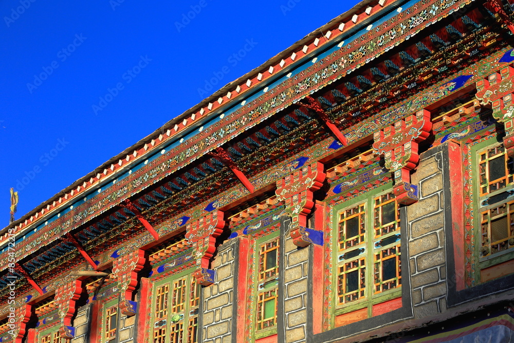 Fototapeta premium Profusely decorated manycolored roof eaves. Gyantse-Tibet. 1593