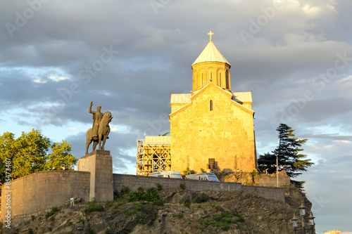 Metekhi temple and statue of Vakhtang Gorgasali. The city Tbilisi has a population of 1.5 million people photo