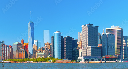 Fototapeta Naklejka Na Ścianę i Meble -  New York City lower Manhattan financial  wall street district buildings skyline on a beautiful summer day with blue sky