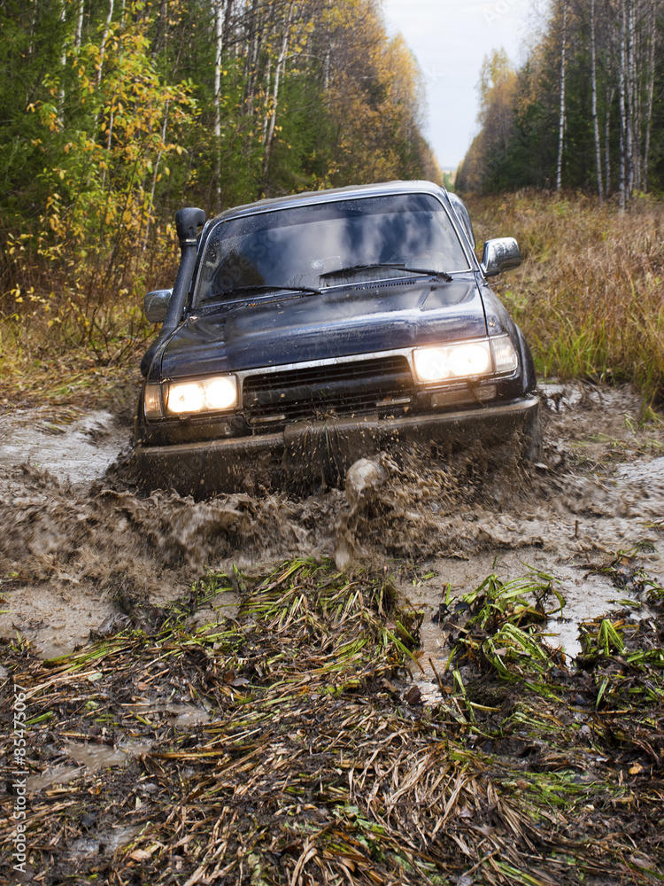Off road vehicle coming out of a mud hole hazard