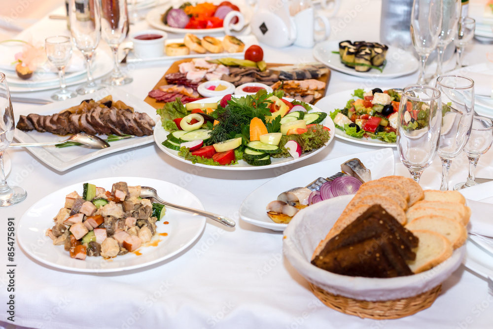 salads and cold cuts at the banquet table