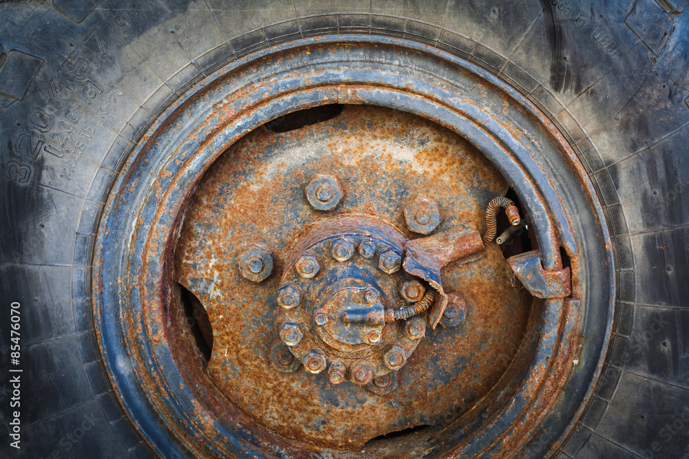 close up  of an old, rusty wheel. iso 100, heavy processed for hdr tone mapping effect.