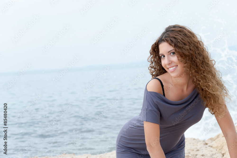 Posing at the beach against a cloudy sky Posing at the beach against a cloudy sky