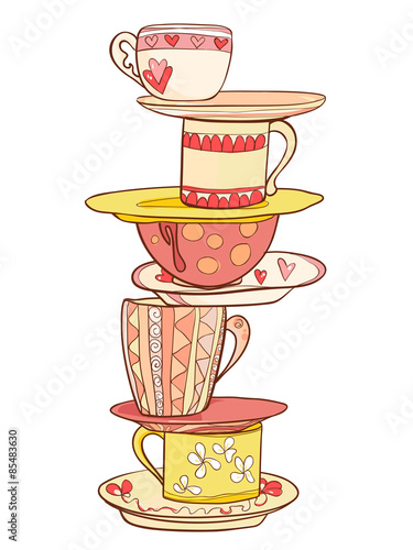 A stack of beautiful cups and mugs with saucers in warm colors