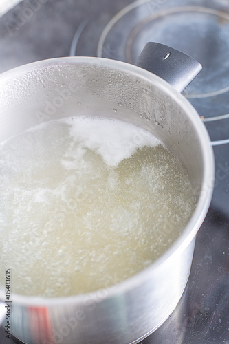 Boiling water on a pan while cooking pasta