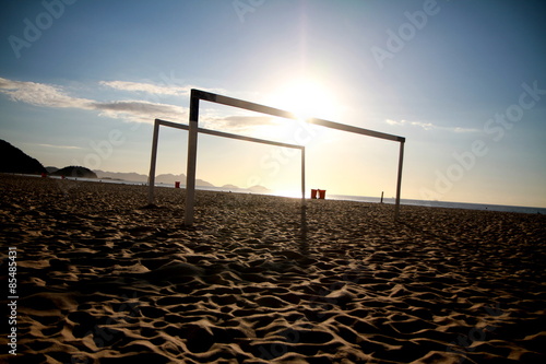 Two goals with the sun and the ocean in the background at the Copacabana beach in Rio de Janeiro, Brazil.