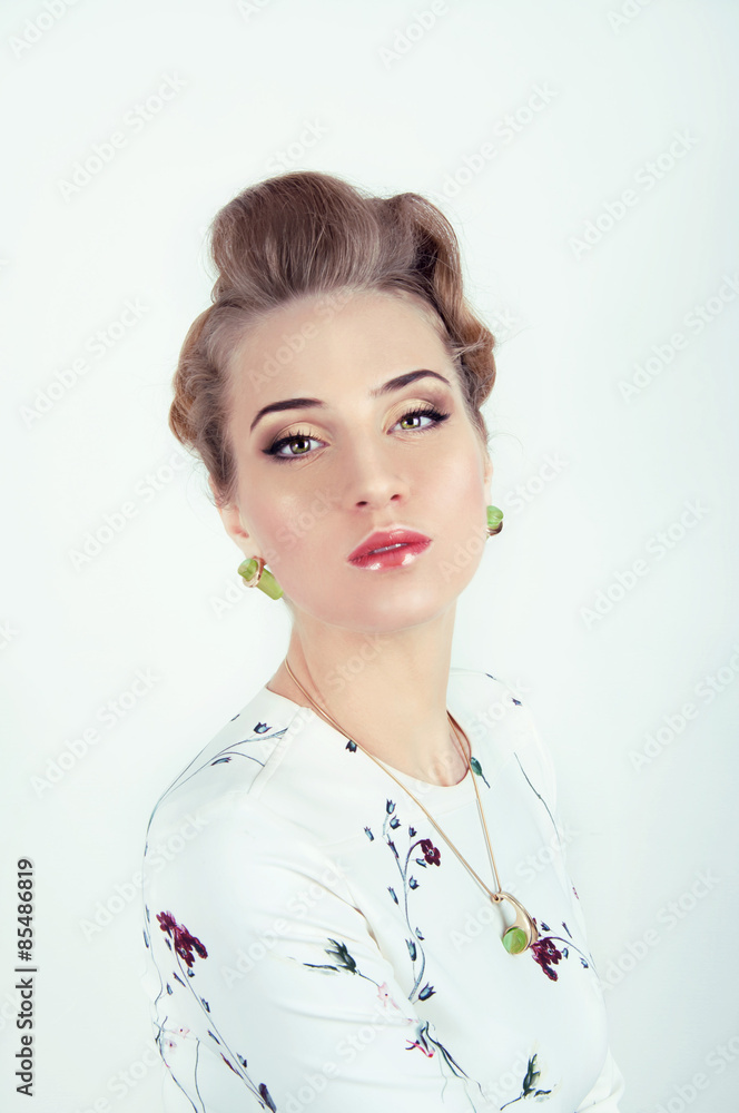 Beautiful sexy woman with natural day makeup wearing green earri Beautiful sexy woman with natural day makeup wearing green earri