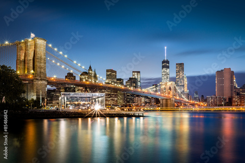 Brooklyn Bridge and the Lower Manhattan skyline at dusk © mandritoiu