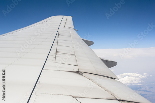 Wing of the airplane in the air