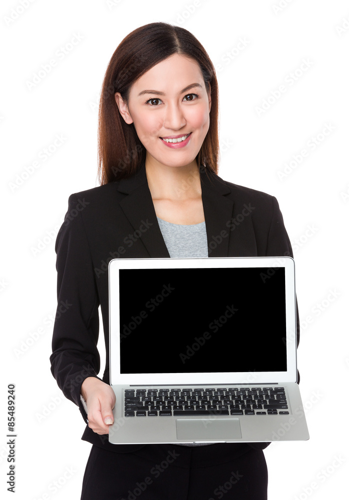 Asian businesswoman show with the blank screen of laptop compute Asian businesswoman show with the blank screen of laptop compute