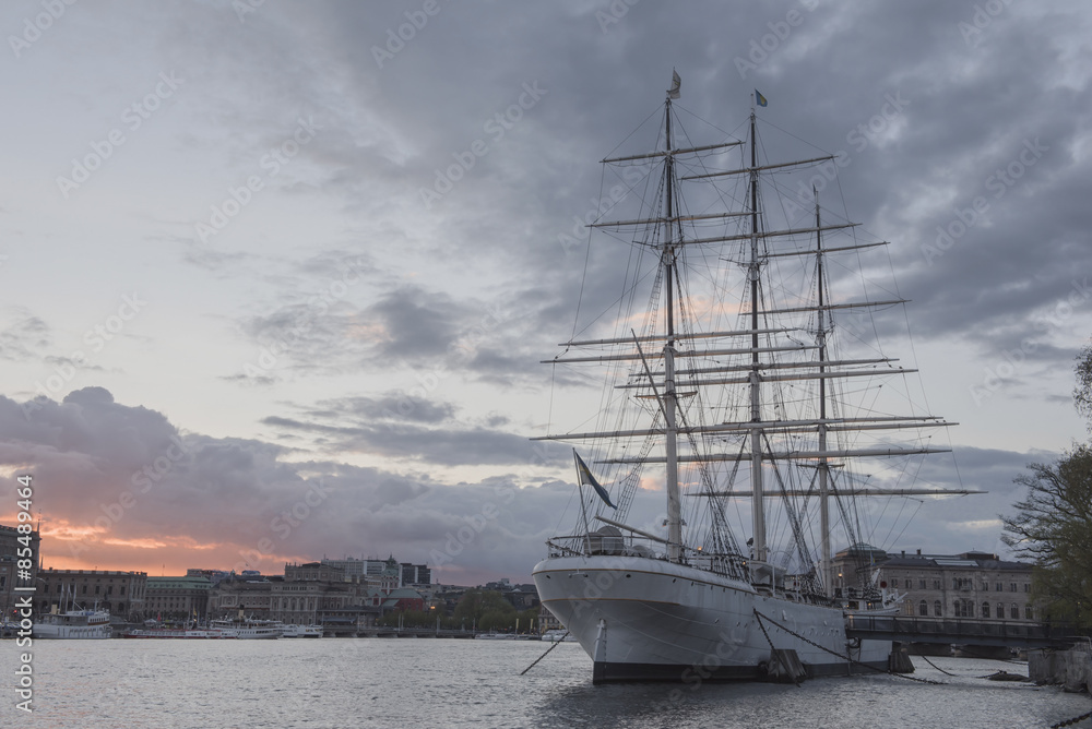 Historical ship with sunset sky at the Old Town in Stockholm, Sweden