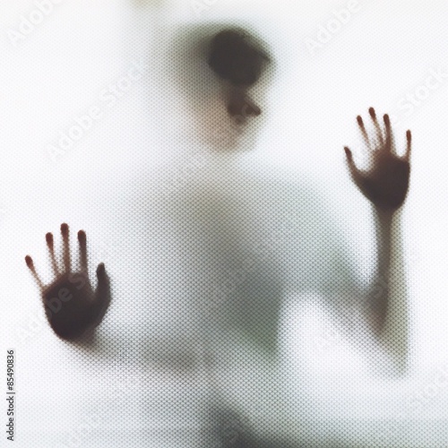 Man standing at the mirror wall