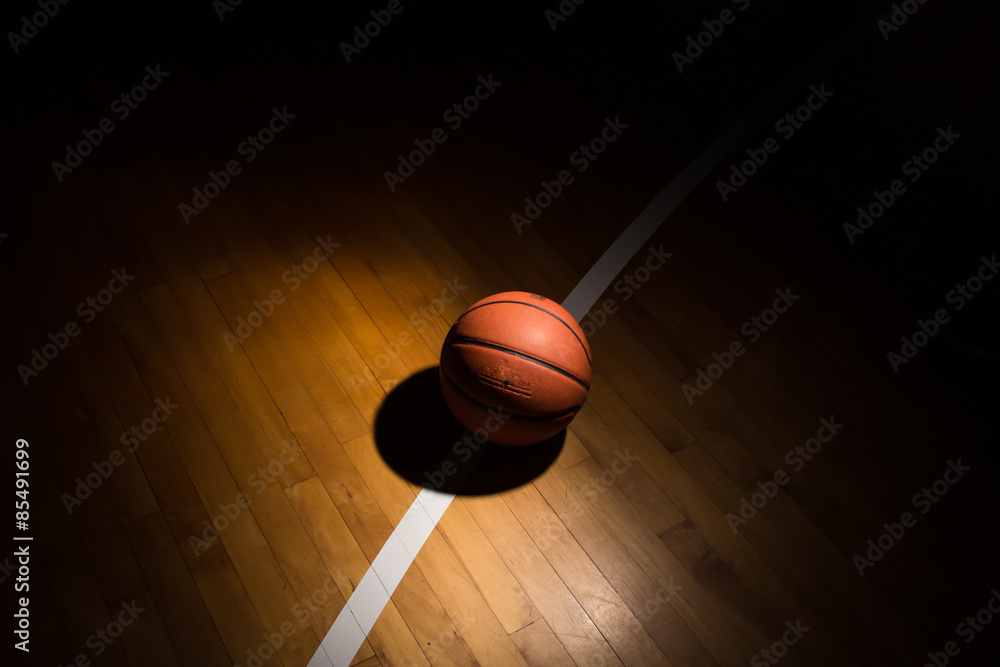 Basketball on court with light effect
