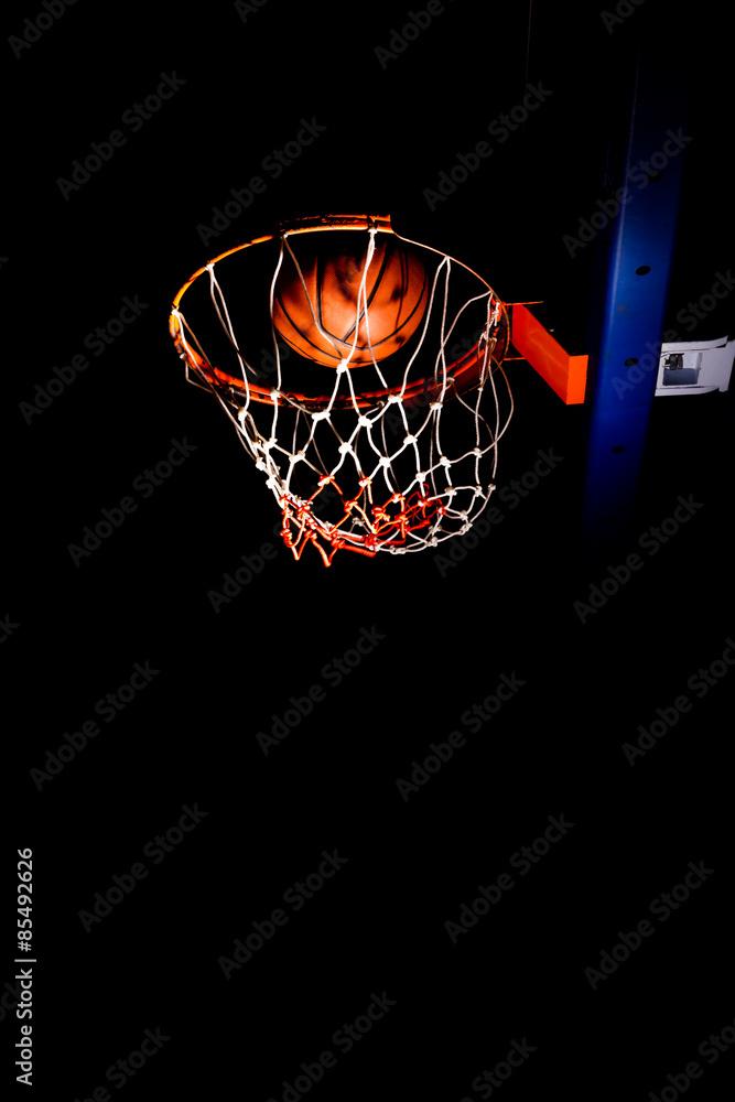 Fototapeta Basketball hood in the dark with light effect
