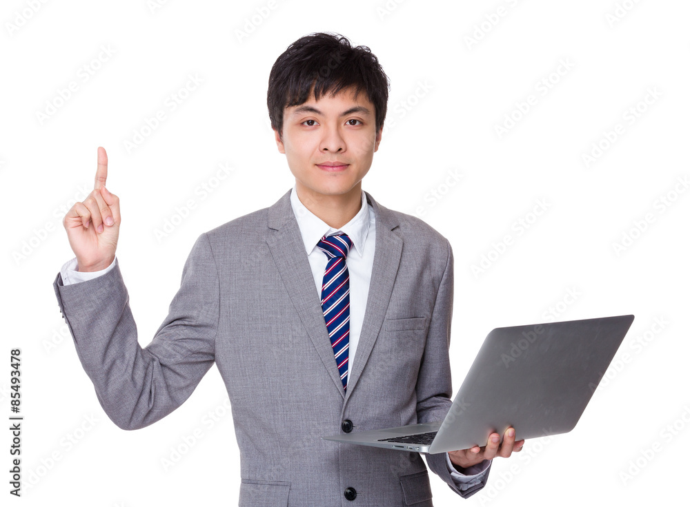 Businessman hold with laptop computer and finger point up Businessman hold with laptop computer and finger point up