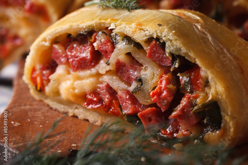 Fotografija tasty pie with ham, cheese and pepper macro horizontal