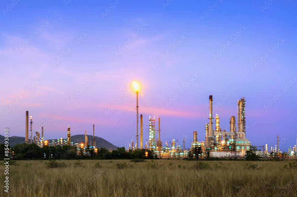 Big Industrial oil tanks in a refinery with treatment pond at industrial plants. Big Industrial oil tanks in a refinery with treatment pond at industrial plants.