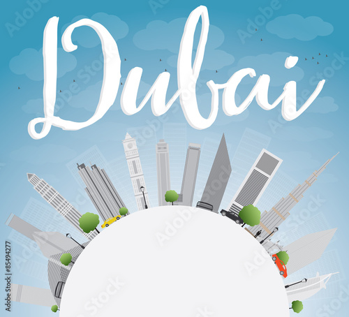 Dubai City skyline with grey skyscrapers, blue sky and copy spac