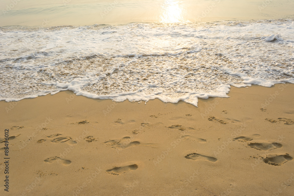 Sea wave and many foot print on the beach background Sea wave and many foot print on the beach background